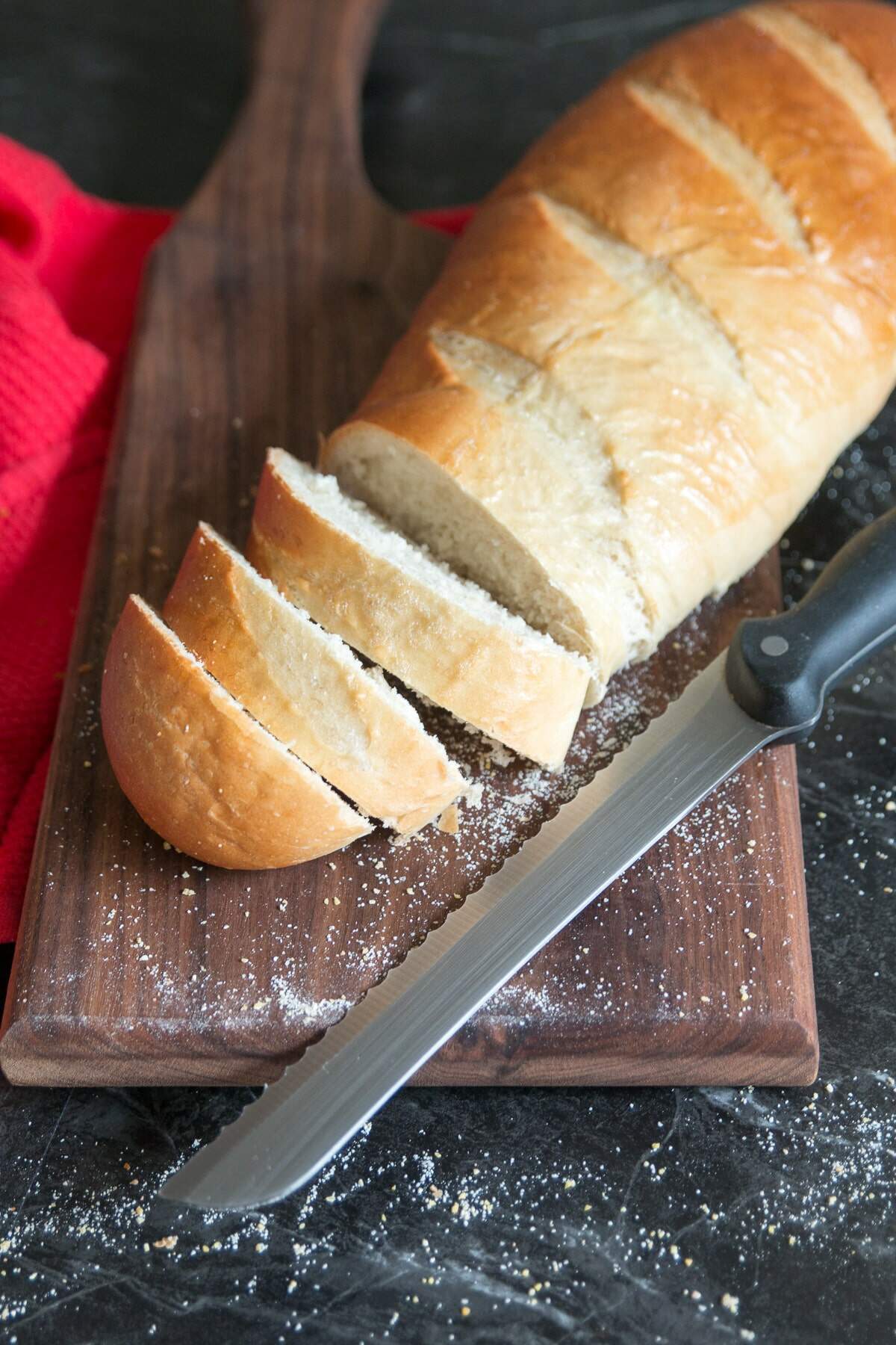 Fresh Homemade Artisan Bread On A Cutting Board With Tea Towel And