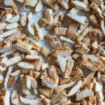 chopped meal prep grilled chicken on sheet pan