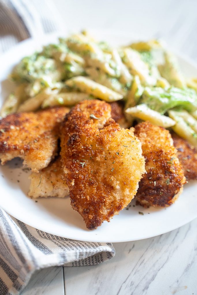 make-ahead breaded chicken with pasta on white plate