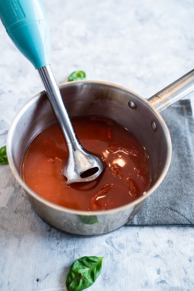 Immersion blender in pot of 5 minute tomato basil soup