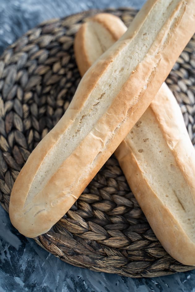 parbaked baguette on basket woven placemat